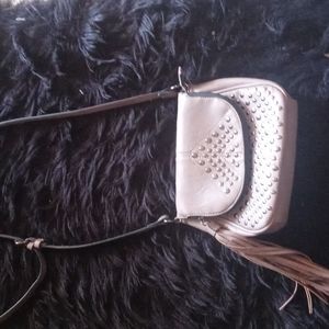 Studded crossbody purse with fringe detail